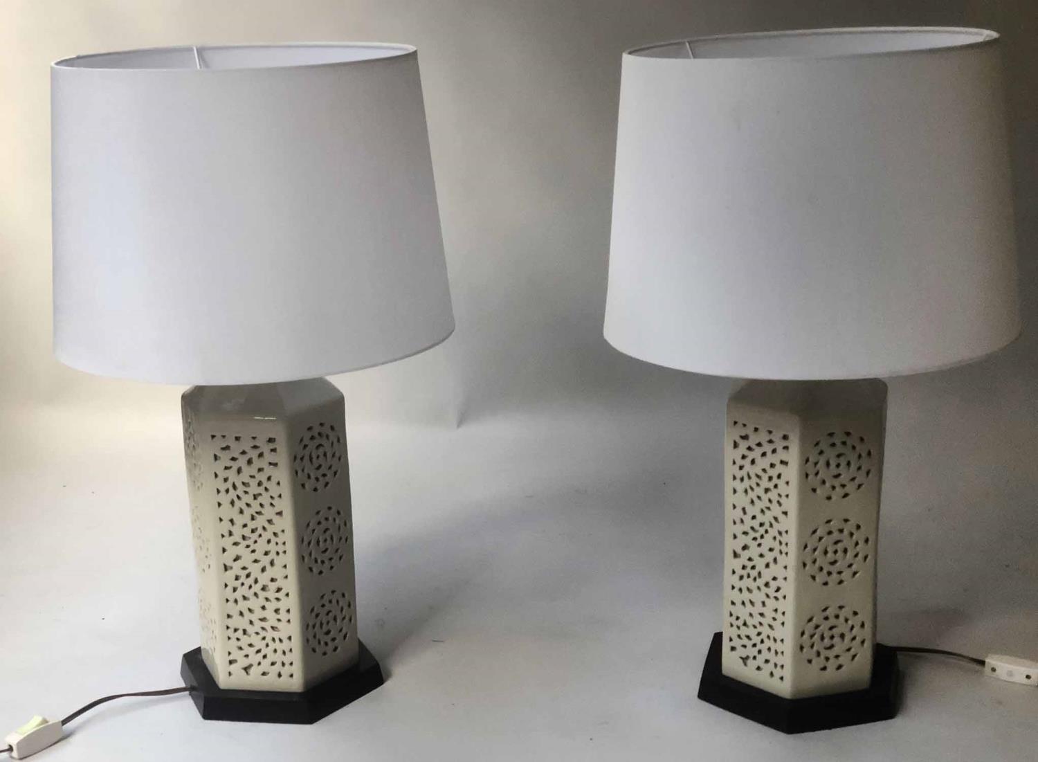 RETICULATED LAMPS, a pair, Chinese hexagonal pierced ivory coloured ceramic on wooden stands, 70cm H - Image 2 of 4