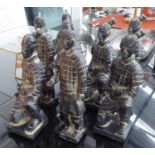 TABLE TOP FAUX TERRACOTTA CHINESE WARRIORS, a set of eight, various poses, largest 35cm. (8)
