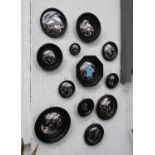 CONVEX WALL MIRRORS, a set of twelve, Regency style, various sizes and shapes, ebonised finish, 26cm