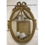 WALL MIRROR, circa 1900, French giltwood with oval ribbon and swag decorated frame, 85cm H x