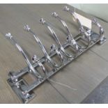 WALL MOUNTING COAT RACK, polished metal finish, ten hooks, 57cm L.