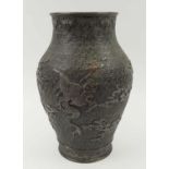 MEIJI PERIOD VASE, bronze with dragons in clouds and bird foliate, 29cm H. (slight faults)