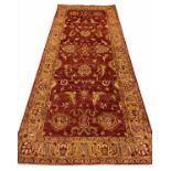 FINE SULTANABAD RUNNER, 296cm x 119cm, palmette and vine terracotta field.