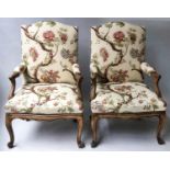 FAUTEUILS, a pair, Louis XV style walnut with floral shrub printed upholstery. (2)