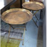 TRAY TABLES, a pair, gilt metal finish, 66cm H x 66cm diam. (2)