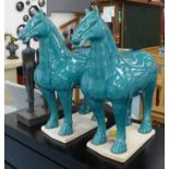 TANG STYLE HORSES, a pair, turquoise blue glazed finish, 51cm H. (2)