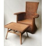 CONSERVATORY ARMCHAIR, faded cane and rattanwoven with broad arms together with a low table, chair