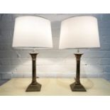 TABLE LAMPS, a pair, silvered Corinthian columns with stepped bases and shades. 47cm H. (2)