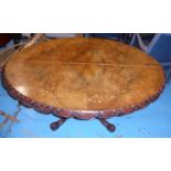 LOO TABLE, Victorian walnut and marquetry inlaid with oval tilt top and carved border on turned