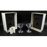 SWAROVSKI CRYSTAL VASES, a pair, faw shaped with blue ring facetted finish in original boxes. (2)
