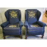 WING ARMCHAIRS, a pair, Georgian style with cushion seats in blue and floral needlework, 98cm H x