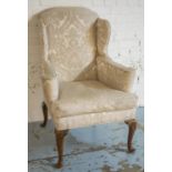 WING ARMCHAIR, late 19th/early 20th century George I style walnut, in cream damask with cushion