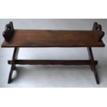 HALL BENCH, Arts and Crafts oak, rectangular with shaped handle pierced ends and trestle supports,