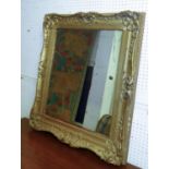 WALL MIRROR, 19th century giltwood with scroll, leaf and floral decoration, 68cm x 81cm. (with