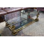 MAISON CHARLES STYLE LOW TABLE, brass and burr walnut with two tinted glass tiers on horse head