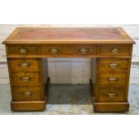 PEDESTAL DESK, late Victorian walnut, circa 1880, with old red leather top above nine drawers and