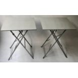 BISTRO TABLES, a pair, French grey painted, square with folding x supports, 60cm x 60cm x 72cm. (2)