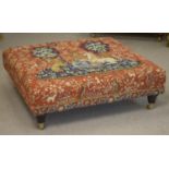 HEARTH STOOL, red tapestry style lion and unicorn design upholstery on brass castors, 93cm W x