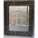 WALL MIRROR, 19th century Dutch repoussé silvered metal, rectangular with foliate corners, 60cm W