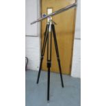 DECORATIVE TELESCOPE, on ebonised stand, stands at 155cm H.