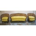 BERGERE SUITE, circa 1900, walnut comprising a sofa, 170cm W and pair of chairs with caned backs and