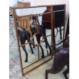 WALL MIRRORS, a pair, section plate, gilt frame, 111cm x 70cm. (2)