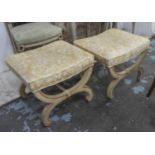 STOOLS, a pair, yellow patterned upholstered seats on painted, curved and carved supports, 48cm x