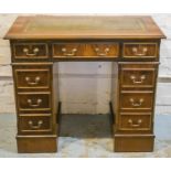 PEDESTAL DESK, Georgian style mahogany with green leather top above eight drawers, 79cm H x 94cm x