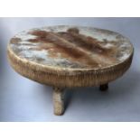 DRUM TABLE, circular African stretched on splay supports, 95cm diam x 46cm H.