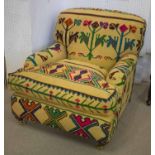 ARMCHAIR, yellow kilim upholstered with seat cushion and front castors, 84cm H x 85cm x 104cm.