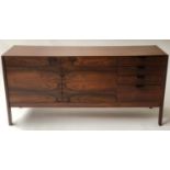 SIDEBOARD, rosewood of two doors and four drawers with leather handles by Robert Heritage for