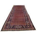 FINE ANTIQUE NORTH WEST PERSIAN KELLEH, 485cm x 197cm, all over boteh field, within a repeat