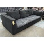 LIGNE ROSET SOFA, black with patterned cushions on metal supports, 95cm x 230cm.