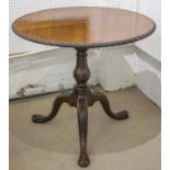 TRIPOD TABLE, fine 18th century American red walnut with circular gadrooned edge tilt top on bird