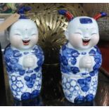LAUGHING CHILDREN, Chinese export style blue and white ceramic, 28cm H approx. (2)