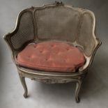 BERGERE, early 20th century French Louis XV style parcel gilt grey painted and cane upholstered,