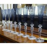 BACCARAT CHAMPAGNE FLUTES, a set of eight, blue glass, each 30cm H.