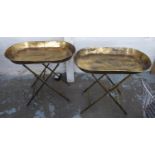 TRAY TABLES, a pair, champagne gilt metal finish, 68cm x 39cm x 66.5cm approx. (2)