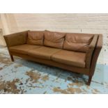 DANISH SOFA, 1970's design teak and soft tan leather upholstered, with seat, back and side cushions.