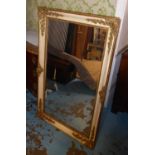 WALL MIRROR, 19th century Continental gilt and cream with scroll and flowerhead decoration, 87cm W x