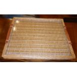 HERMES PARIS WICKER TRAY, with a glass top and tan leather handles, 53cm x 43cm.