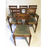 DINING CHAIRS, a set of six, early 20th century oak with fluted rail backs. (6)