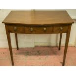 BOWFRONT WRITING TABLE, George III mahogany with three drawers, 73cm H x 84cm W x 50cm D.