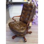 DESK SWIVEL CHAIR, by John Widdicomb, brown buttoned leather, bears plaque, 64cm x 97cm H. (two