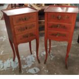 BEDSIDE TABLES, a pair, Chinoiserie red lacquered with three drawers on slender supports, 71cm H x