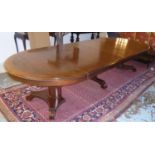 DINING TABLE, early 20th century mahogany and string inlaid extending with four extra leaves on