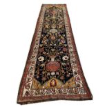 FINE ANTIQUE BIDJAR RUNNER, 425cm x 117cm, vase and bird design field, within a repeat rosette