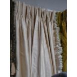 CURTAINS, a pair, ivory silk, lined and interlined, each curtain 70cm gathered x 145cm drop.