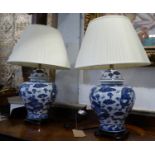 TABLE LAMPS, a pair, Chinese export style blue and white ceramic, with shades, 69cm H. (2)