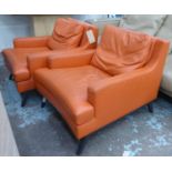 LIGNE ROSET ARMCHAIRS, a pair, orange leather upholstered, 80cm x 93cm x 72cm H. (2)